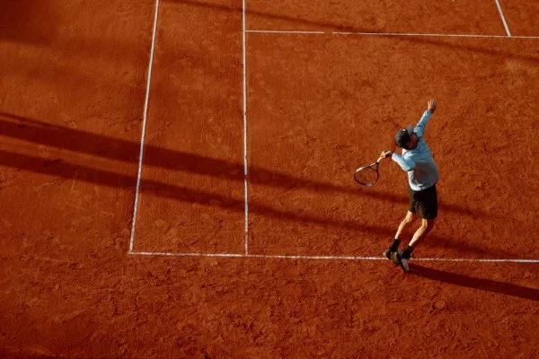 tennis clay court match action